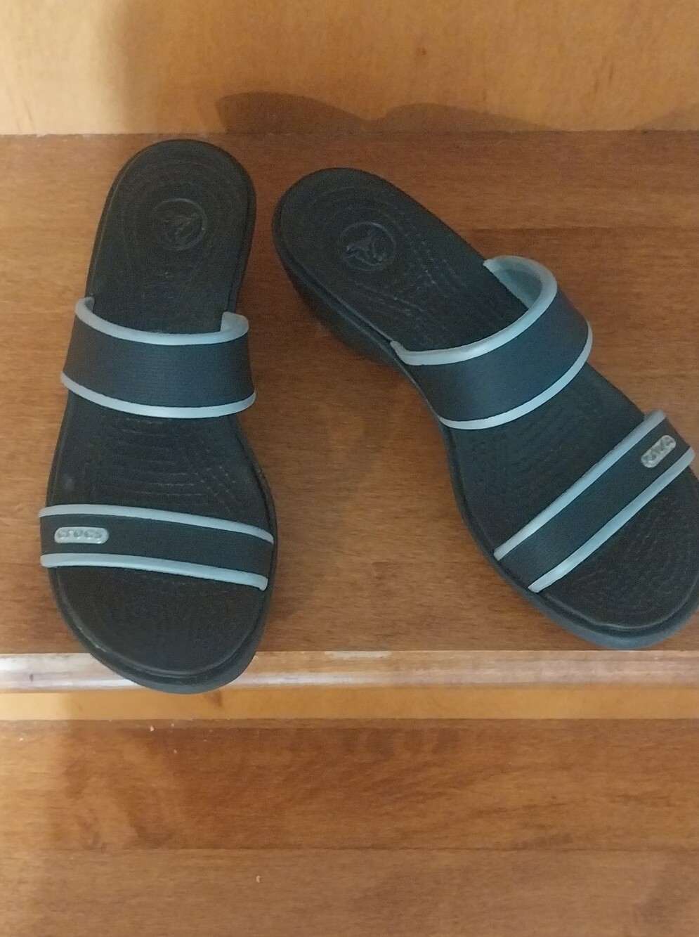 Crocs Black Slide Sandals with Light Blue Trim